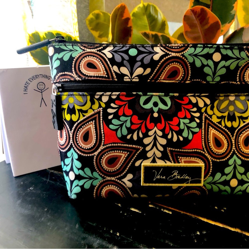 Vera Bradley Nylon water resistant material. Extra pocket on the outside